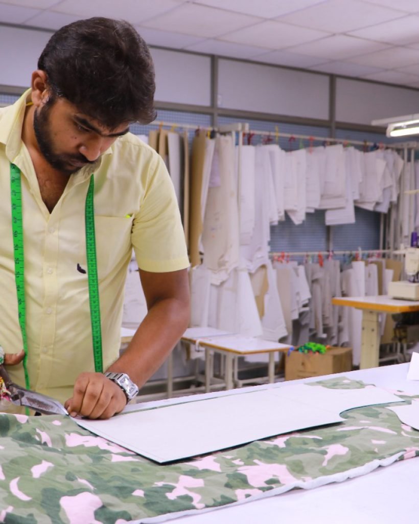 Worker Sewing Fabric